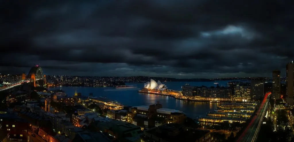 A night time photo of Sydney Harbor in Australia. 