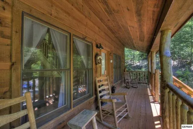 Honeymoon Cabin porch with rocking chairs