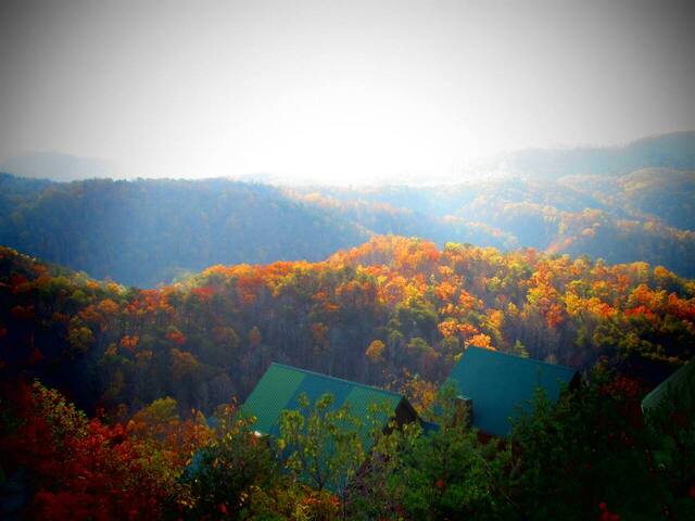 view from log cabin over the mountains during fall 