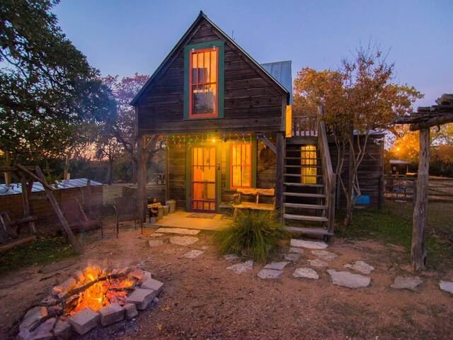 Secluded cabin exterior with fire pit near Fredericksburg Texas