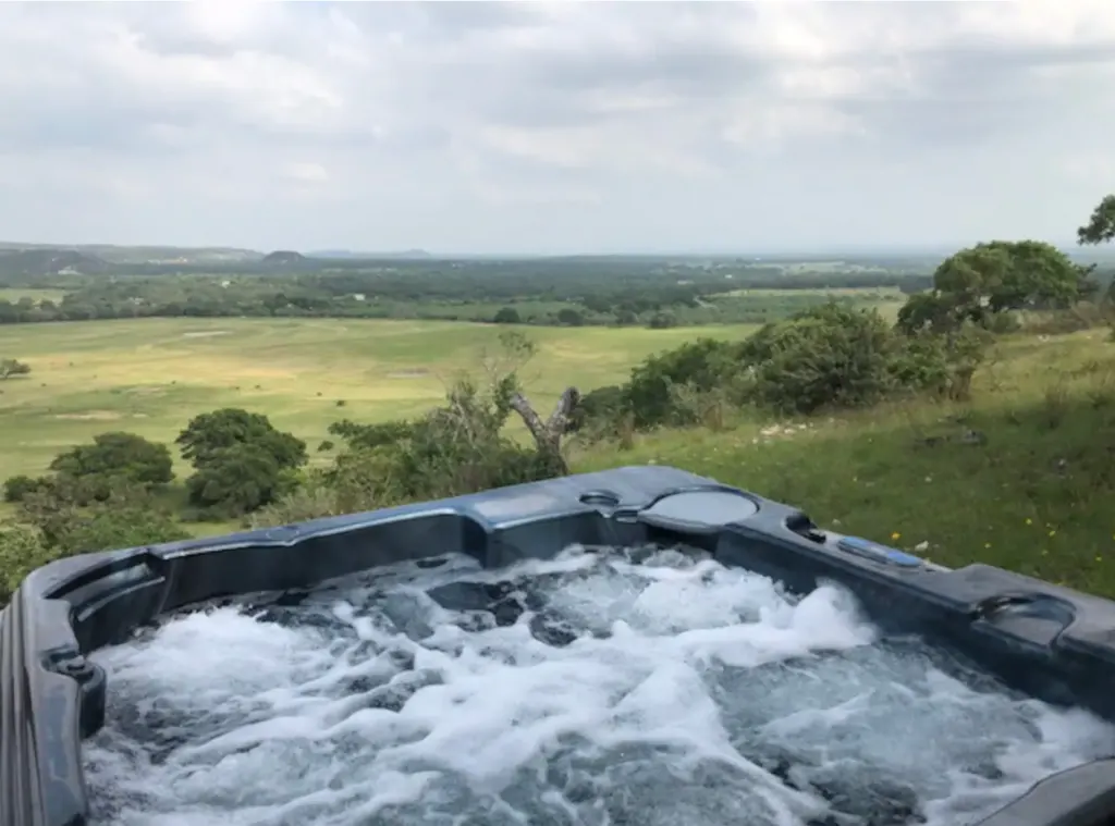 hot tub with a view from the cabin