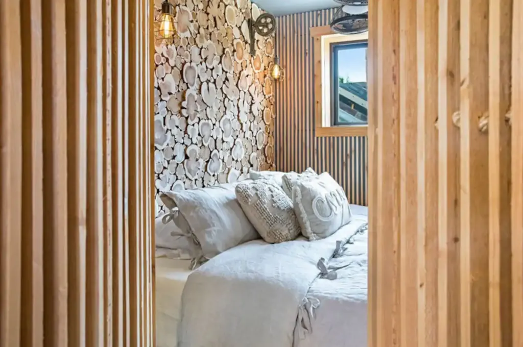 cabin bedroom with beautiful unique wood walls