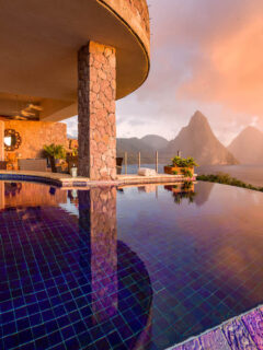 Private pool outside a suite at Jade Mountain resort overlooking mountains and lush forests.