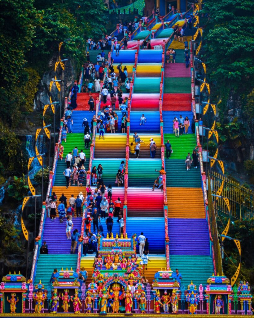 Very colorful stairs crowded with people in Malaysia.