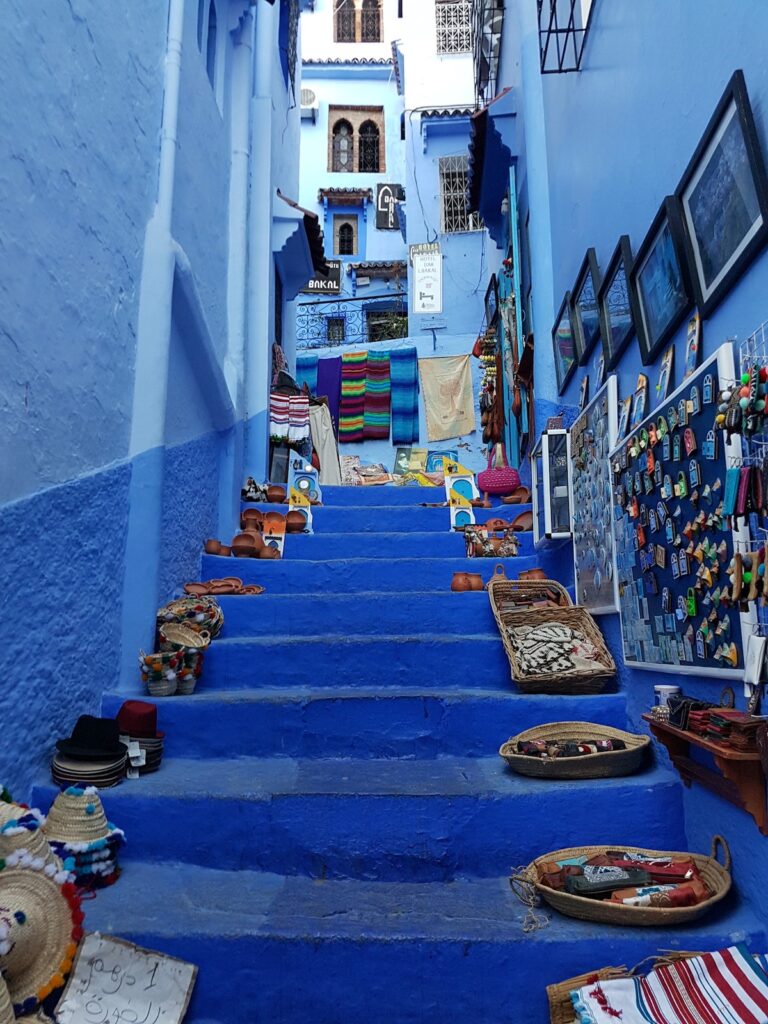 Moroccan stairway surrounded by blue buildings around.