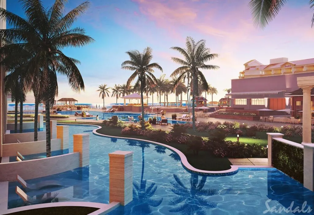 Pool at Sandals Royal Bahamian with palm trees surrounding it.