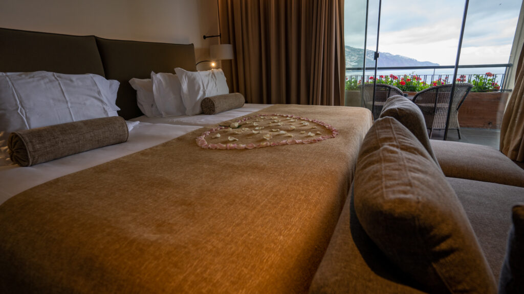 romantic cliffbay hotel bed with roses in shape of heart