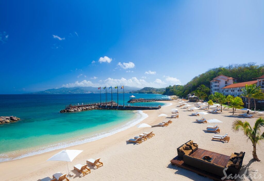 Sandals Grenada beach area with lounge chairs