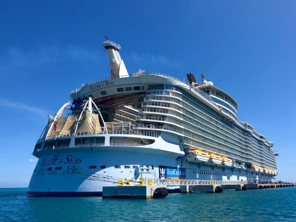 View of the back of a large cruise ship on the ocean.