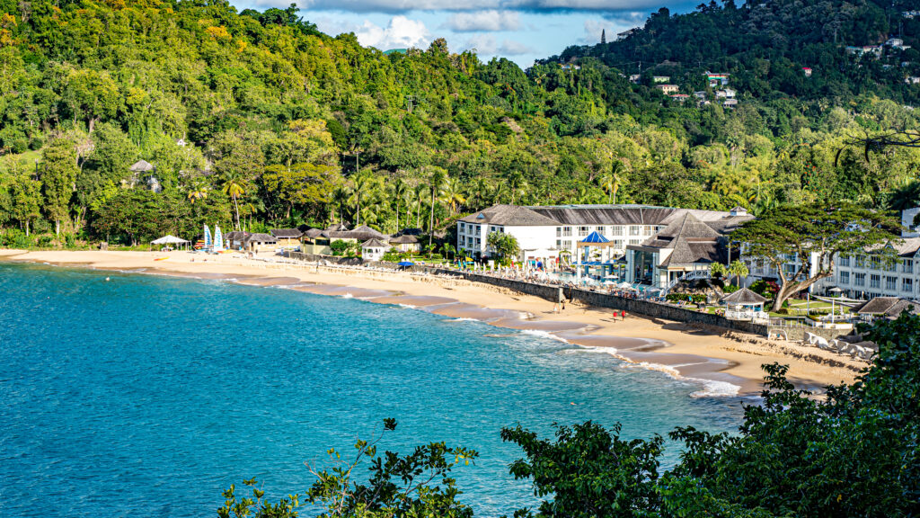 View from a cliff looking at the beach in front of Sandals Regency La Toc.